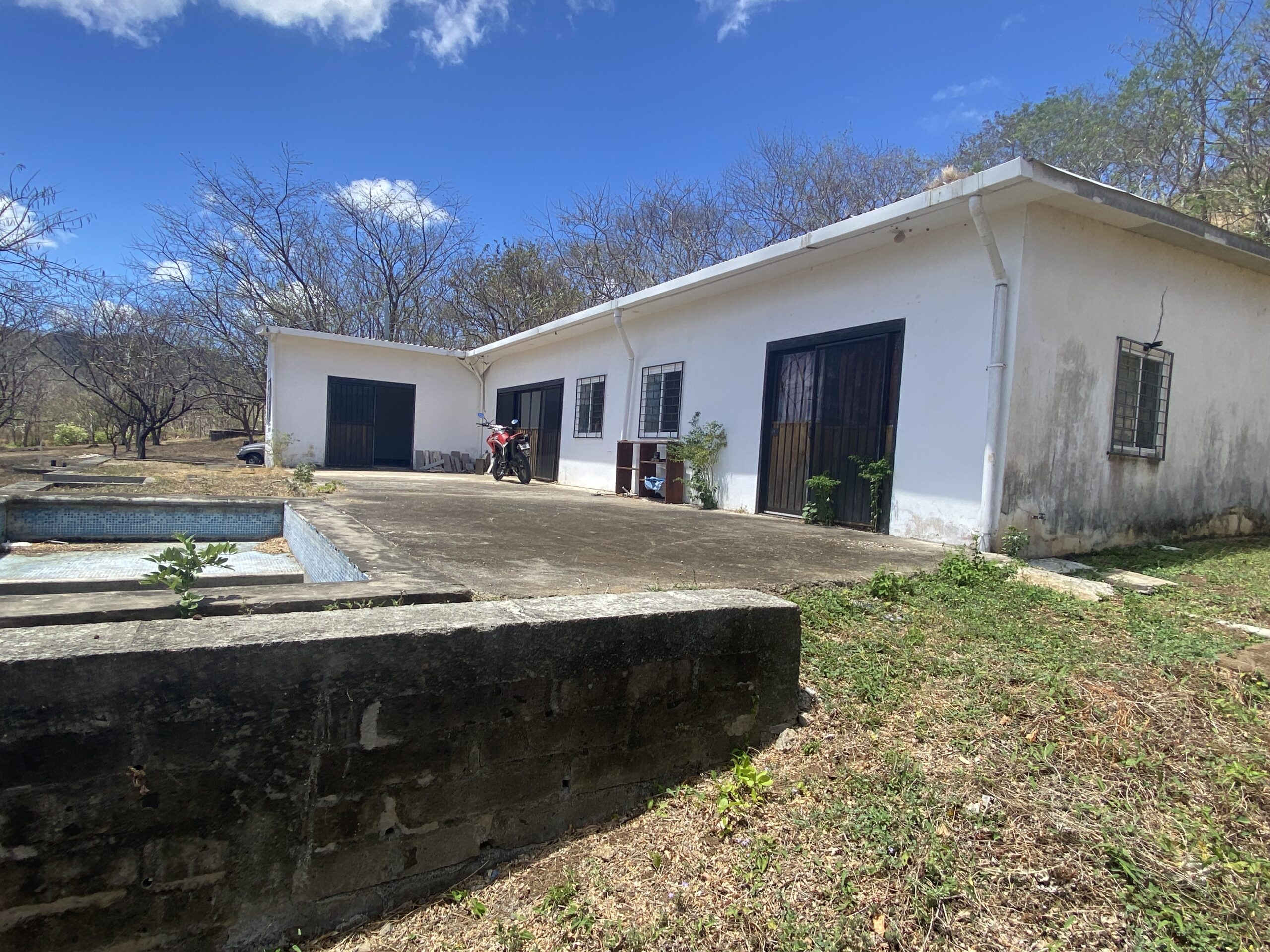 Two homes with private pools on 1.75 Acres (1mz) with loads of potential!
